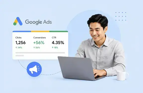 Filipino male digital marketer using Google Ads dashboard on a laptop with analytics and advertising performance metrics on a light blue background.