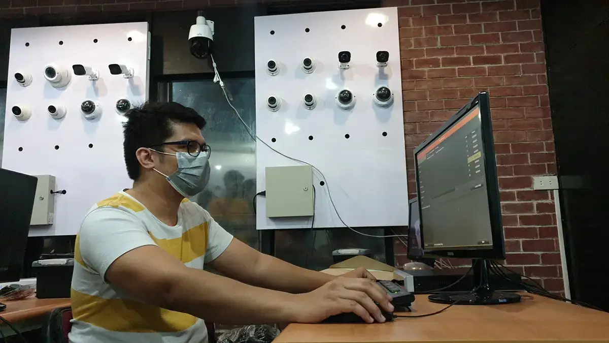 A student at Inventive Media configuring security surveillance software during a hands-on CCTV training session in the Philippines