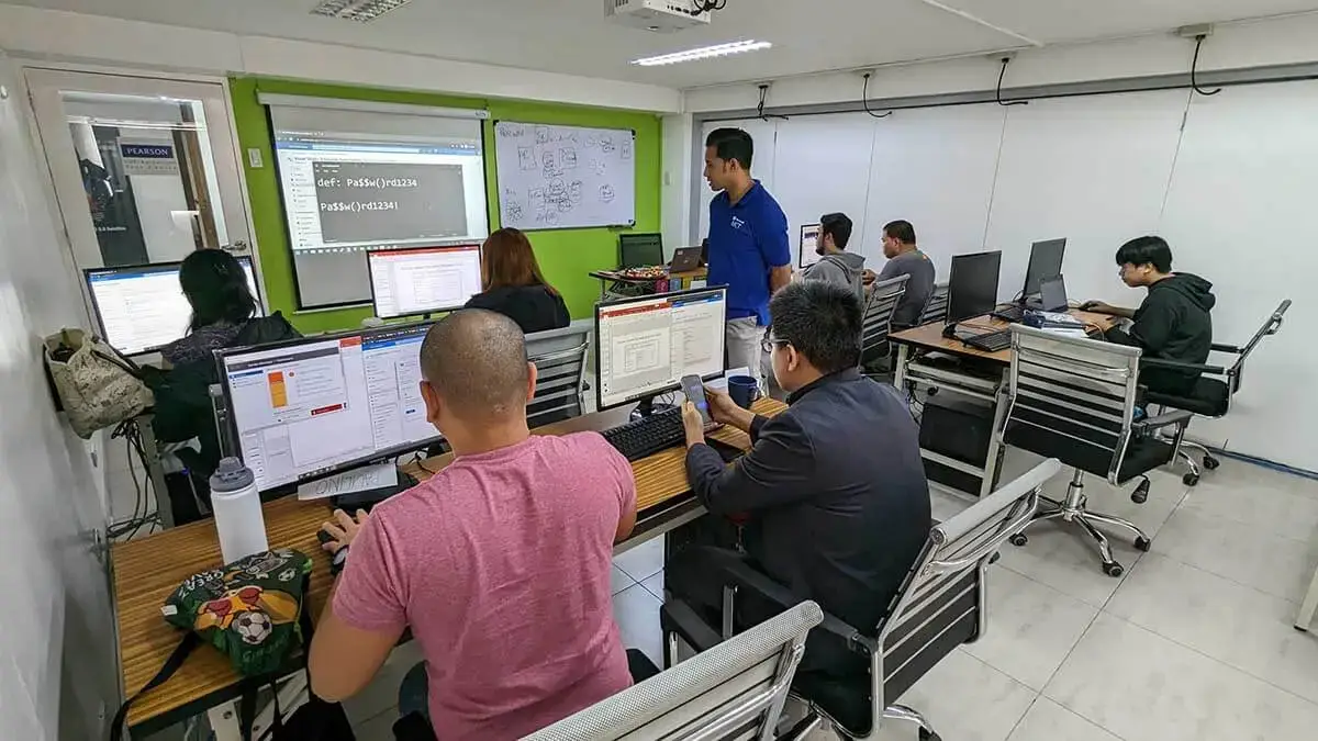 A professional holding a Microsoft Azure certification certificate in Manila